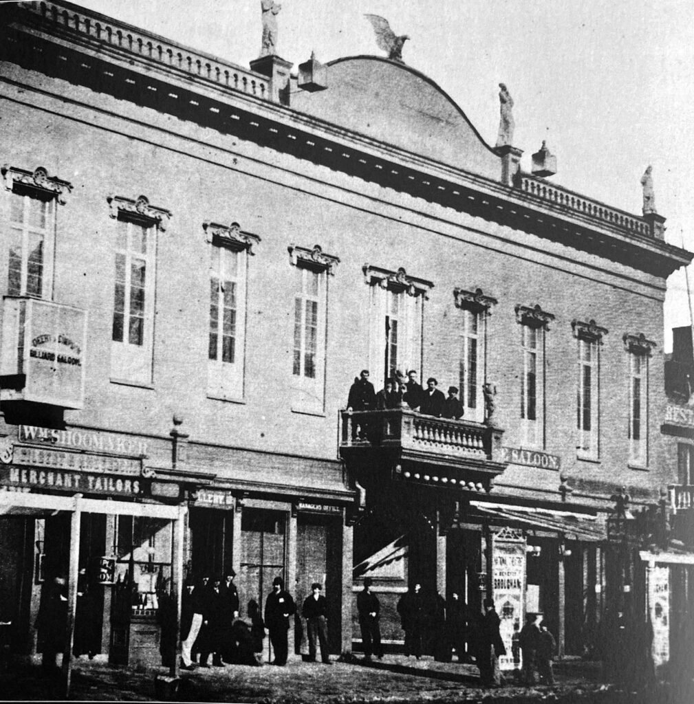 Photograph of patrons on the oudoor balcony at The National in the 1860s or 1870s.