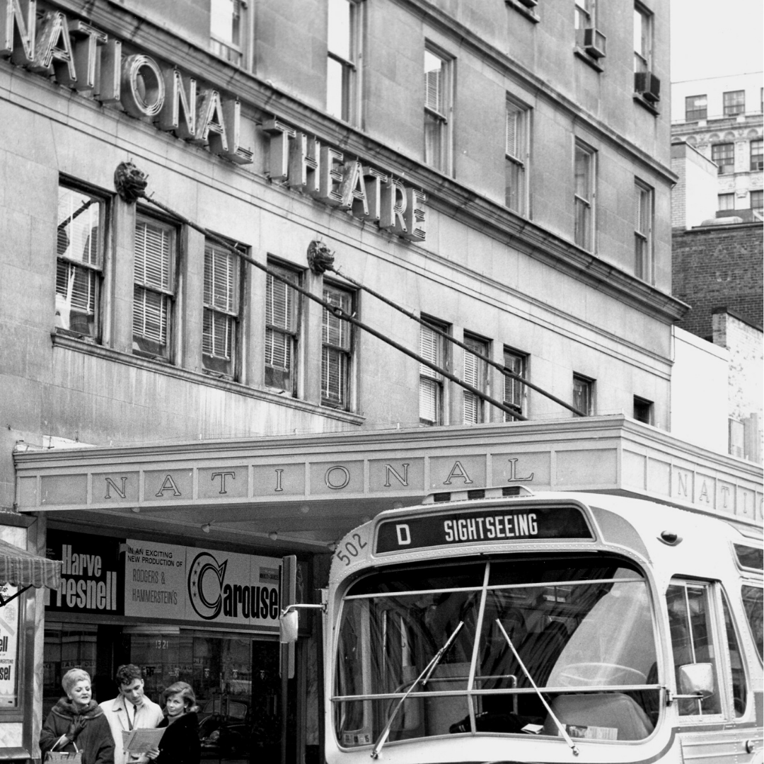 A black and white historic image of the exterior of The National Theatre